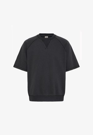 Felpa nera a maniche corte in un tessuto morbido, con maniche raglan, scollatura a girocollo e orlo e polsini a costine.