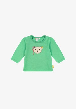 Grøn langærmet babytrøje med broderet bamseansigt med blomsterhovedbånd på brystet og en knap nær kraven.