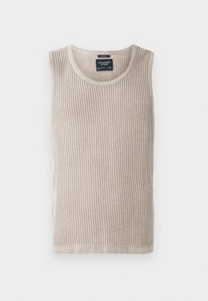 Débardeur beige côtelé avec un col rond, sans manches et texture douce. Étiquette cousue à l'intérieur de la zone du cou, ourlet propre.