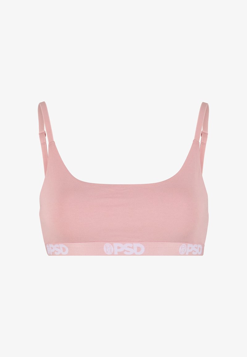 Brassière de sport rose clair avec fines bretelles réglables et une bande blanche avec logo en bas.