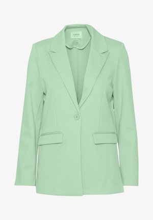 Mintgroene blazer van een gladde stof. Heeft een gekleed kraag, enkele knoopsluiting en twee voorzakken. Strakke lijnen.