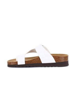 Sandalo bianco con strappi incrociati, dotato di una soletta in sughero e una suola marrone testurizzata. Design piatto adatto per un abbigliamento casual.