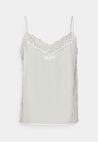 Bílá bezramínková košilka s nastavitelnými ramínky a krajkovým lemem podél výstřihu do V a horních okrajů.