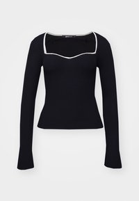 Svart ribbad långärmad topp med fyrkantig halsringning och vit kant längs kragen, figurnära silhuett.