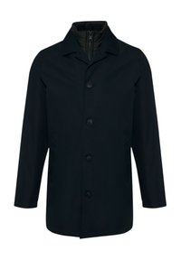 Manteau d'extérieur noir présentant une coupe droite, un col pointu et une fermeture à boutons, avec une doublure intérieure zippée pour plus de chaleur.