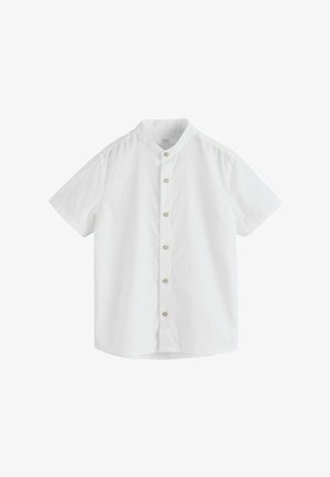 Balta īsroku krekls ar mandarīna apkakli un sešām bēšām pogām priekšpusē.