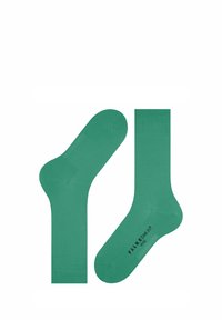 Zielone bawełniane skarpetki o gładkiej fakturze, z prążkowanymi mankietami i nadrukowanym logo na podeszwie. Prosty krój, długość na kostkę.
