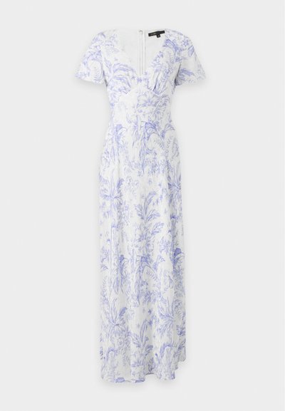 Robe maxi blanche à manches courtes avec motif floral violet, décolleté en V et taille cintrée avec fermeture éclair au dos.