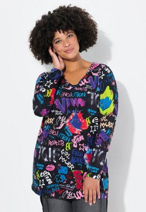 Long-sleeve top in black fabric featuring colorful graffiti-style text and designs in pink, blue, green, and white. V-neckline and loose fit.