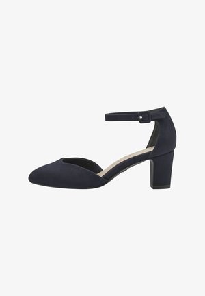 Navyblaue Wildleder-Pumps mit einem ausgeschnittenen Zehendesign, verstellbarem Knöchelriemen und einem mittelhohen Blockabsatz für zusätzliche Stabilität.