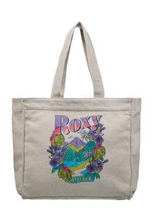 Beżowa torba na zakupy z płótna z kolorowymi tropikalnymi kwiatami, palmami, górami i napisem „Roxy 1990” z przodu.