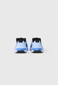 Blue and black Nike Metcon training shoes, featuring a textured upper, padded collar, and rubber outsole with traction patterns.