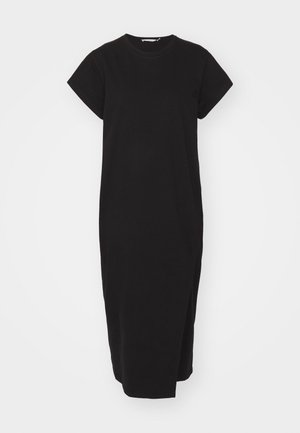 Vestido de algodón negro con mangas cortas, escote redondo y silueta recta. Presenta aberturas laterales para facilitar el movimiento.