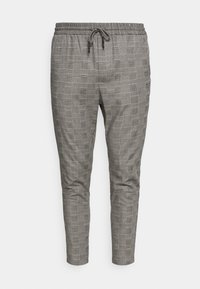 Grå rutiga byxor med elastiskt midjeband och dragsko. Avsmalnande passform med mjuk textur och subtilt rutig mönster genom hela plagget.