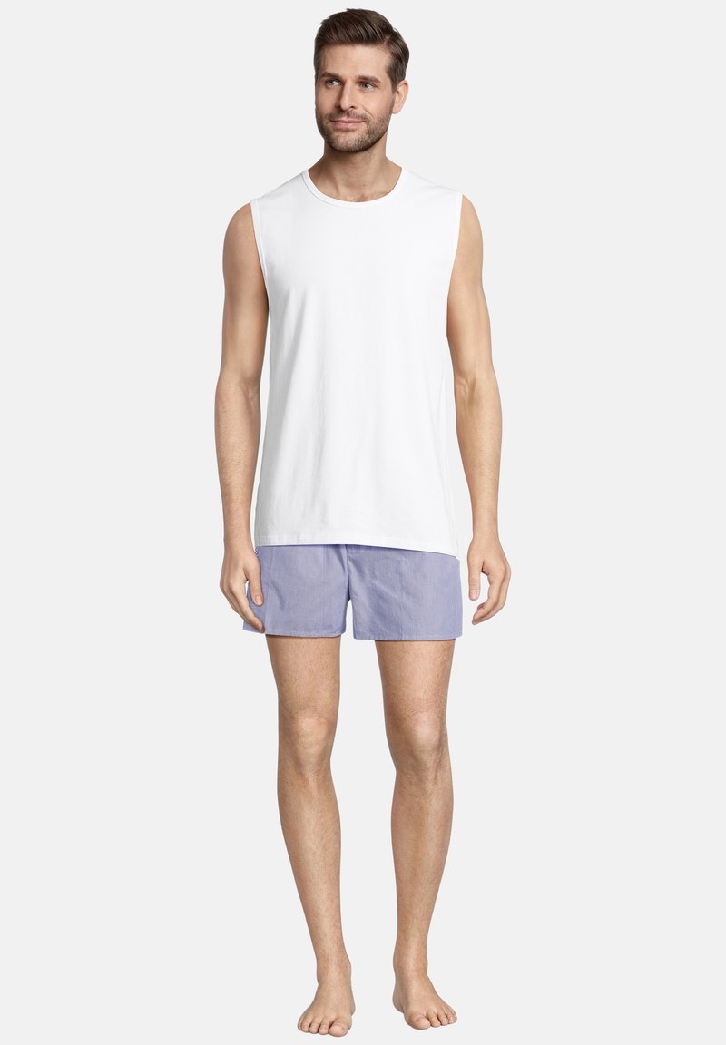 White sleeveless top and light purple striped shorts. The fabric appears smooth with a casual fit. No visible patterns or additional details.