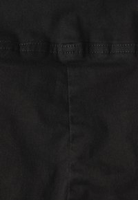 Black fabric with a smooth texture, showcasing a neat seam detail along the top. The material appears sturdy and tightly woven.