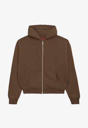 Bruine zip-up hoodie van zacht materiaal, met een buidelzak, geribde manchetten en een capuchon. Glad materiaal met minimale details.