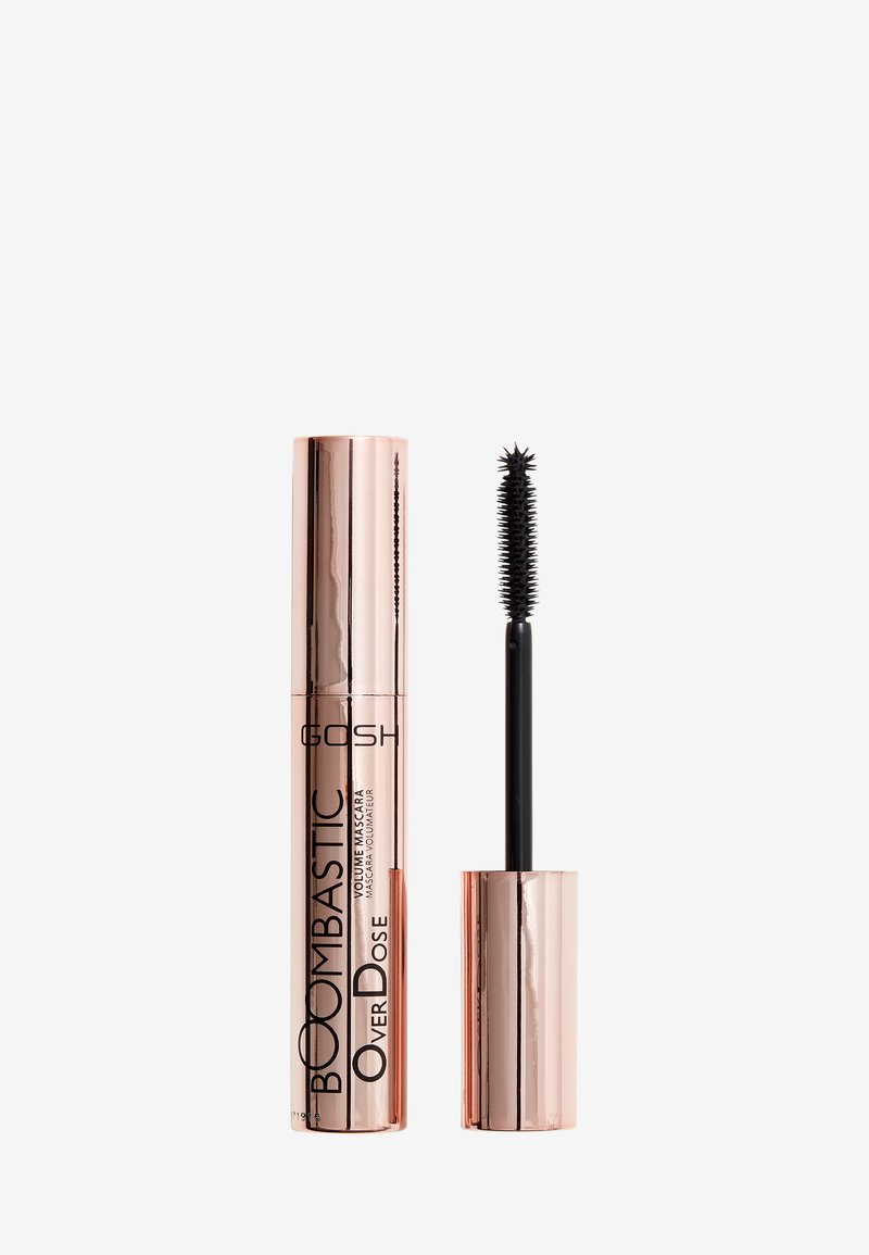 Roze-gouden mascara tube met een stijlvolle afwerking; een zwarte borstelwand steekt uit de tube. Tekst op de tube luidt "BOOMBASTIC OVERDOSE VOLUME MASCARA."