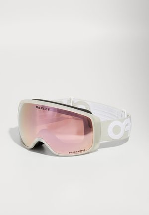 Snow goggles with a translucent white frame and pink tinted lens; features a soft gray strap with white logo text and a black interior lining.