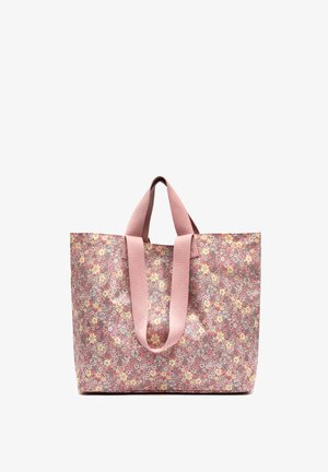 Sac fourre-tout floral rose avec des anses larges en tissu, forme rectangulaire, et un petit motif floral dense en jaune et blanc.