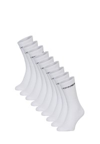 Pack van tien paar witte sokken met ribbelboorden en een zwart logo. Zachte, rekbare stof met een gladde textuur en een design tot de kuit.
