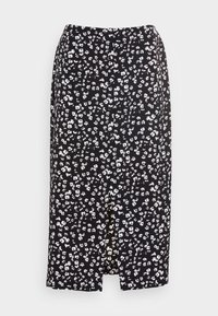 Svart kjol med vitt blommönster, knälång, med en framslits och knappdetaljer. Tillverkad av lätt, mjukt tyg.