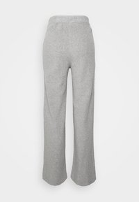 Light grey, wide-leg fleece pants with elastic waistband, shown flat from the back on a white background.