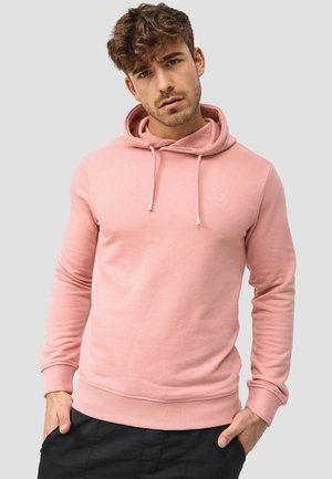 Light pink hoodie with a drawstring hood, ribbed cuffs and hem, featuring a small embroidered logo on the chest. Soft fabric texture.