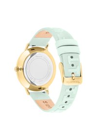 Goldfarbener Uhr mit einem runden Gehäuse aus Edelstahl. Verfügt über ein mintgrünes Silikonarmband mit geprägten Details und einer goldenen Schnalle.
