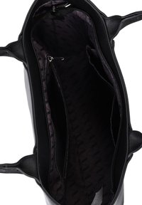 Black leather bag interior with a smooth texture, featuring a central zippered pocket and two side compartments against a patterned lining.