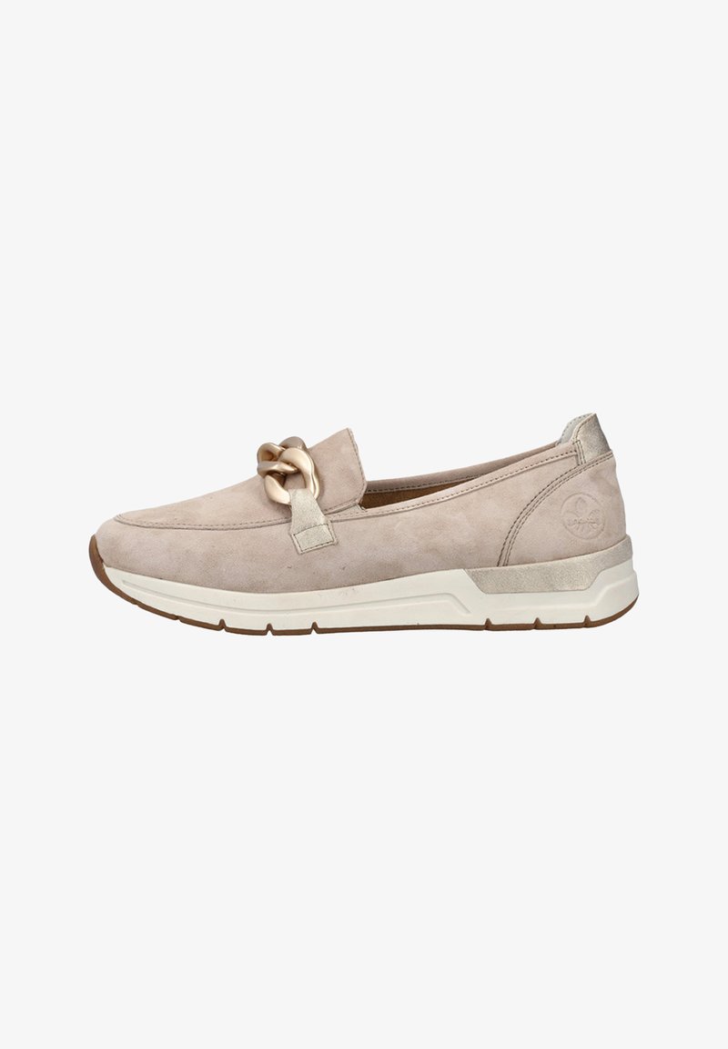 Beige suede slip-on shoe with a knotted brown accent, textured material, contrasting white sole, and metallic detailing on the heel.
