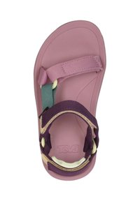 Sandal Teva con una suela de goma rosa, correas de nailon morado y azul verdoso, y hebilla ajustable. Superficie suave sin patrones visibles.