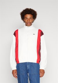 Lacoste - SHOWERPROOF TRACKJACKET - Suvejakk - flour/spleen red Väikepilt 1