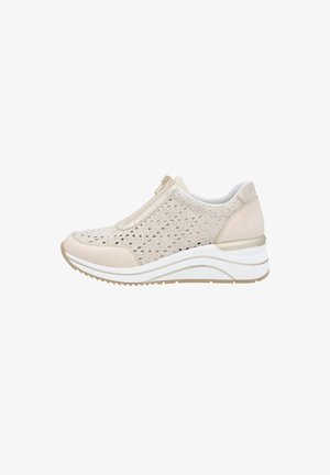 Beige slip-on shoes with a textured, breathable upper, metallic accent at the zipper, and a white cushioned sole with a slight wedge.