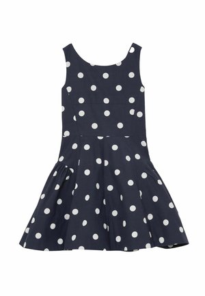 Granatowa sukienka bez rękawów w białe kropki, z dopasowanym gorsetem i rozkloszowanym dołem.
