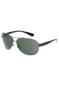 Occhiali da sole Ray-Ban con montatura sottile in metallo nero, lenti ovali verdi e naselli regolabili; logo sulla tempia. Design leggero, stile sportivo.