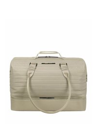 Sac de voyage rectangulaire beige avec texture matelassée, double poignées, fermeture éclair sur le dessus et compartiment zippé supplémentaire en bas.