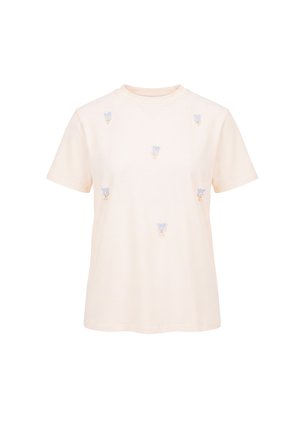 Kortærmet cremefarvet t-shirt med seks små blå blomsterbroderier jævnt fordelt på forsiden.