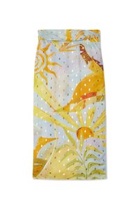 Brightly colored fabric featuring a sunny design with gold dots and tropical leaves, evoking a cheerful, summery atmosphere.