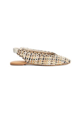 Flat woven slingback shoe with beige, white, black, and brown braided pattern and tan sole, viewed from the side on a white background.
