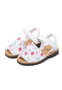 White sandals with colorful hot air balloon and heart patterns. Features a closed toe, adjustable straps, and a textured rubber sole.