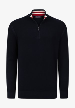 Suéter de punto azul marino con cuello de media cremallera que presenta un interior del cuello a rayas rojas y blancas. Mangas largas y diseño de color sólido.