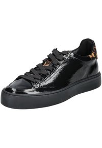Black patent leather sneaker with a textured design, black laces, and a contrasting leopard-print detail at the heel. Flat black rubber sole.