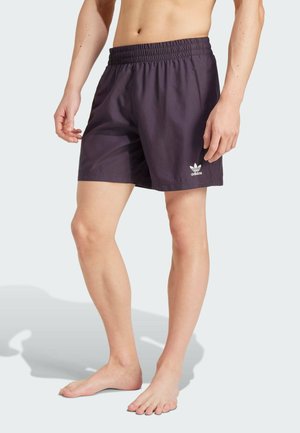 Marineblaue Badeshorts aus leichtem Stoff mit einem elastischen Bund und dem weißen Adidas-Logo am linken Saum.