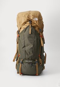 Green and brown nylon backpack with a top lid, adjustable straps, and multiple compartments. Features "TRAIL LITE 65" text on the front.