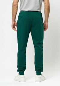 U.S. Polo Assn. TERKEL - Treniņtērpa apakšdaļas - rain forest