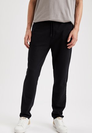 SLIM FIT - Pantaloni sportivi - black