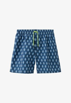 Costume da bagno blu navy con motivi a diamante bianchi e coulisse verde lime su una vita elastica.