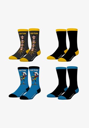 Quatre paires de chaussettes de sport : deux paires présentent des personnages de Lucky Luke avec des accents jaunes et bleus ; deux paires sont entièrement noires avec des talons et des pointes assortis.