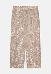 Pantalons Palazzo en tissu beige, ornés de rangées verticales de sequins argentés, dotés d'une ceinture élastique et d'un design ample et fluide.